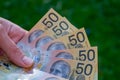 Hands holding australian dollars 50 banknotes Royalty Free Stock Photo