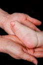 Hands holding baby foot Royalty Free Stock Photo