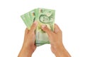 Hands holding baht money. Royalty Free Stock Photo