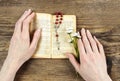 Hands holding the Bible and praying with a rosary Royalty Free Stock Photo