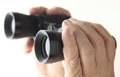 Hands holding binoculars Royalty Free Stock Photo