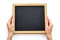 Hands holding a blank chalkboard or blackboard against a transparent background Royalty Free Stock Photo