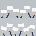 Hands holding blank picket placard. Royalty Free Stock Photo