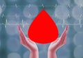 Hands holding blood drop, give blood donation, blood transfusion, world blood donor day, world hemophilia day concept