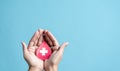 hands holding blood drop paper cut, blood transfusion, world blood donor day, red cross to give blood.world hemophilia day concept Royalty Free Stock Photo