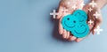 Hands holding blue happy smile face, good feedback rating, positive customer review, experience, satisfaction survey, smiley Royalty Free Stock Photo
