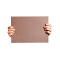 Hands holding a brown clean blank sheet of A4. Isolated on grey