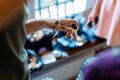 Hands holding a brush and eye shadow, close-up. Stylish makeup artist makes a gorgeous makeup for the bride in the morning Royalty Free Stock Photo