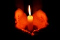 Hands holding burning candle Royalty Free Stock Photo