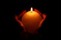 Hands holding burning candle Royalty Free Stock Photo