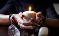 Hands holding a candle Royalty Free Stock Photo