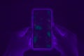 Hands holding cell phone with dirty contaminated touch screen - UV Blacklight exposing infectious bacteria and harmful Royalty Free Stock Photo
