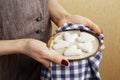 Hands holding ceramic plate with biscuits in the shape of a heart, St.Valentine`s Day concept