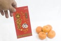 Hands holding a Chinese New Year Red Packet Royalty Free Stock Photo