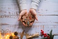 Hands holding christmas gingerbread men cookies Royalty Free Stock Photo