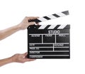 Hands holding a clapper board