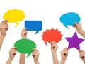 Hands holding colored speech bubbles isolated on white background Royalty Free Stock Photo