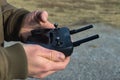 Hands holding controller for drone that uses a cell phone in the winter - selective focus Royalty Free Stock Photo