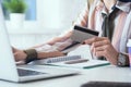 Female office worker hands holding credit card, typing on the keyboard of laptop, onine shopping detail close up.