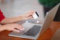 Hands holding credit card and using laptop Royalty Free Stock Photo