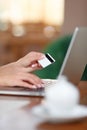 Hands holding credit card and using laptop Royalty Free Stock Photo