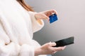 Hands holding credit card and using the smartphone. Online shopping Royalty Free Stock Photo