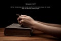 Hands holding a cross on holy Bible with verse Royalty Free Stock Photo