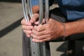 Hands holding crutches Royalty Free Stock Photo