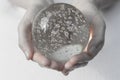 Hands holding a crystal ball Royalty Free Stock Photo