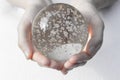 Hands holding a crystal ball Royalty Free Stock Photo