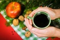 Hands holding a cup of traditional mulled wine