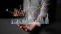 Hands Holding Data Visualization of Graphs and Charts Illustrating Business Growth and Financial Trends in Modern Royalty Free Stock Photo