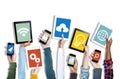 Hands Holding Digital Devices with Various Symbols