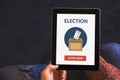 Hands holding digital tablet computer with online voting concept Royalty Free Stock Photo