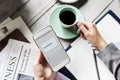 Hands Holding Downloading Mobile Phone with Coffee Cup Beverage