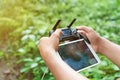 Hands holding drone remote controller