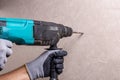 Hands holding electric drill in room, home renovation DIY concept Royalty Free Stock Photo