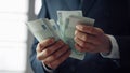 Hands holding european currency close up. Business man counting euro banknotes. Royalty Free Stock Photo