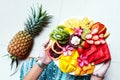 Hands holding fresh fruit plate Royalty Free Stock Photo