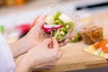 Hands holding Fresh fruits salad in box Royalty Free Stock Photo