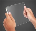 Hands holding futuristic transparent tablet pc