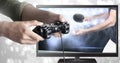 Hands holding gaming controller with table tennis on television Royalty Free Stock Photo