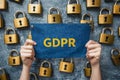 Hands holding GDPR compliance banner background of floating padlocks symbolizing encrypted data protection online security