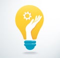 Hands holding gear icon in light bulb icon vector, creative concept Royalty Free Stock Photo