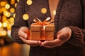 2 hands holding a gift box Royalty Free Stock Photo