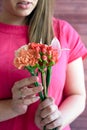 Hands holding girl in red flowers Royalty Free Stock Photo