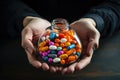 Hands holding glass bowl full of medication with different types and colours. AI generated Royalty Free Stock Photo