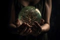 Hands holding glass globe ball with tree and green nature background. eco environment concept. Generative Ai. Royalty Free Stock Photo