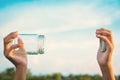 Hands holding glass jar for keeping fresh air Royalty Free Stock Photo