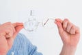 Hands holding glasses for eye test Royalty Free Stock Photo